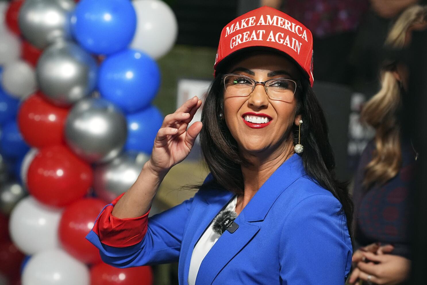 Lauren Boebert wearing a Make America Great Again cap
